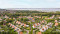 Luchtfoto van Vakantiepark Zeeland Village in Scharendijke, omringd door groen en gelegen nabij het Grevelingenmeer in Zeeland.